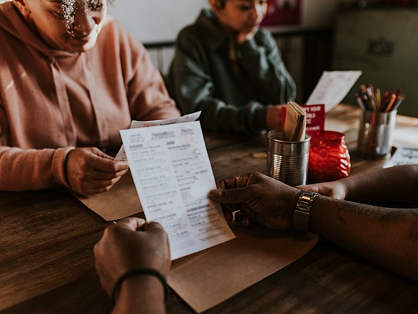 family reading menus in a restaurant